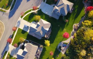 Aerial view of suburban street with homes